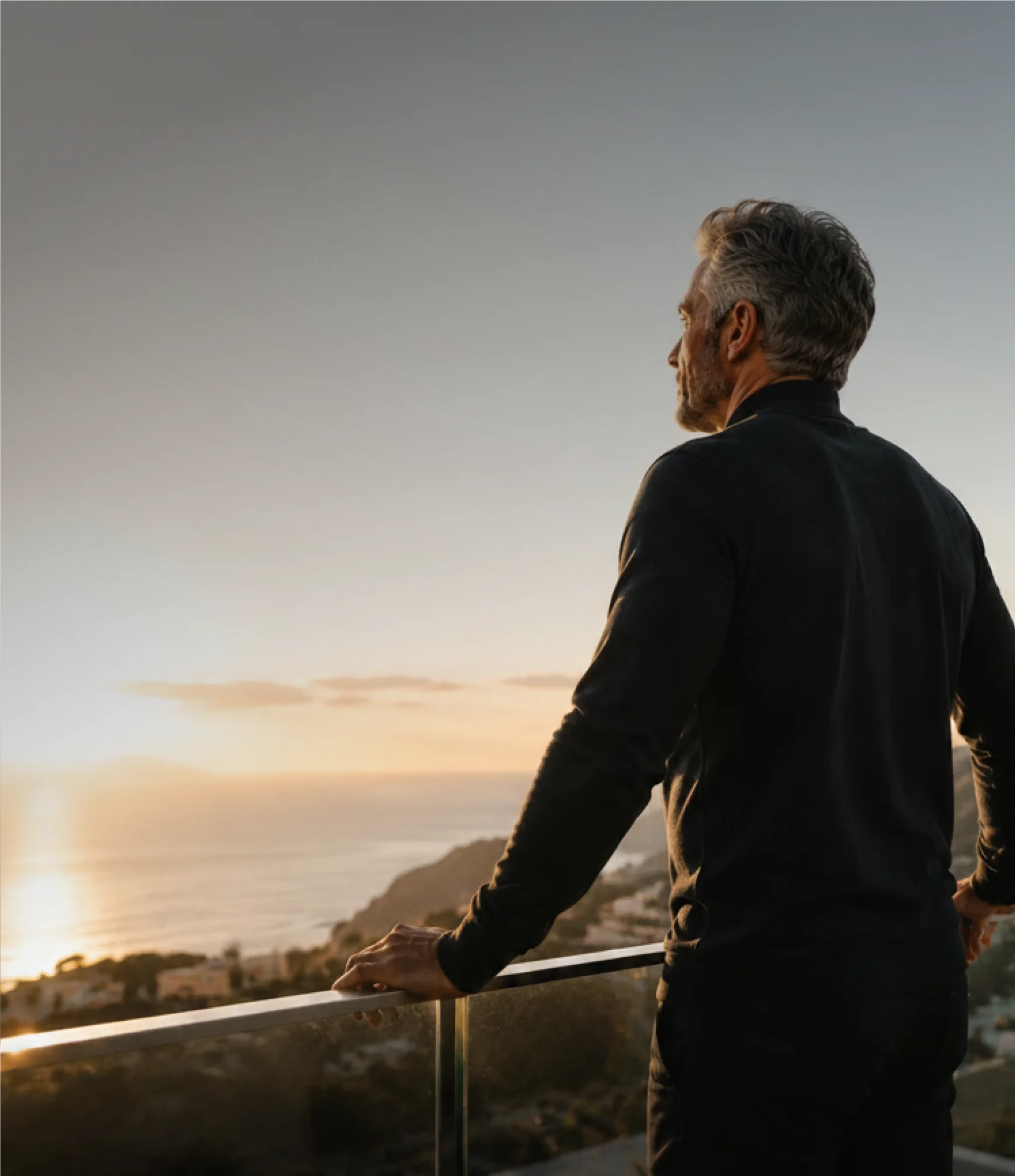 A person outdoors at the end of a training session, calm and considered
